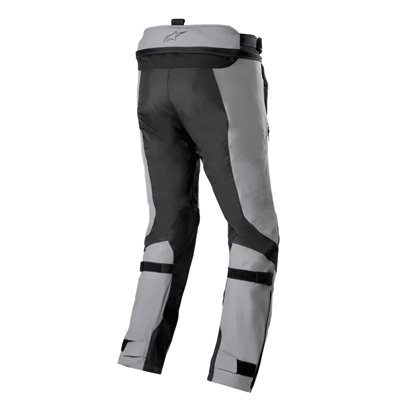 Alpinestars Bogotá Pro Drystar motorbroek in donkergrijs met geel fluo accenten, waterdicht en ademend met CE-Level 2 bescherming, voor veelzijdige weersomstandigheden.